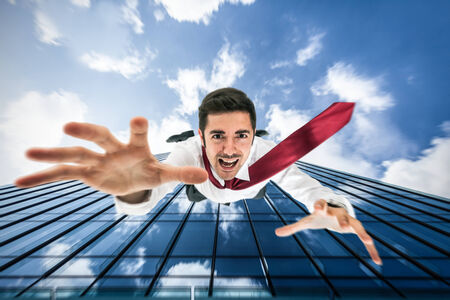 Businessman falling down from a building