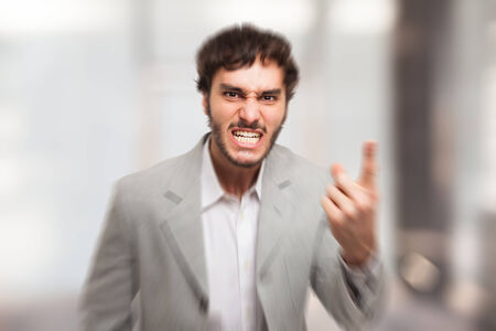 Angry man pointing his finger to youの写真素材