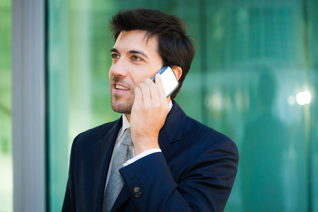 Portrait of a businessman talking on the phoneの写真素材