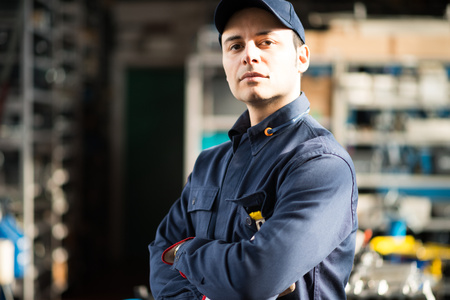 Portrait of a worker in his shop