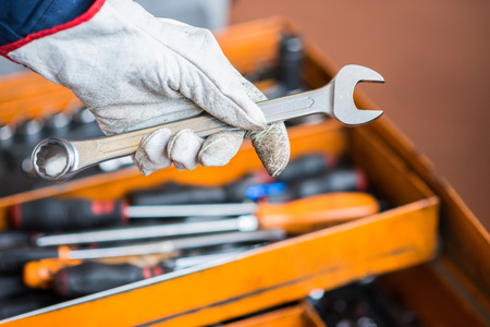 Detail of a worker's hand in a factory