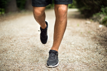 Man running in a park, legs detailの写真素材