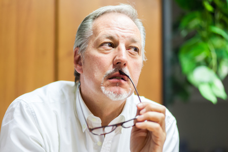Portrait of a pensive businessmanの写真素材