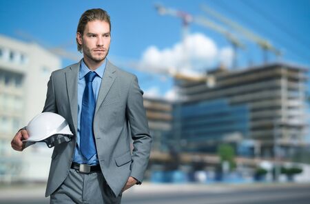Portrait of an architect in front of a construction site