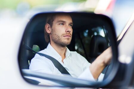 Portrait of a man driving his car