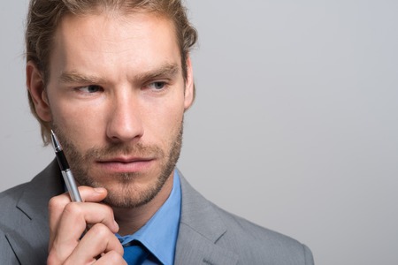 Pensive businessman portraitの写真素材