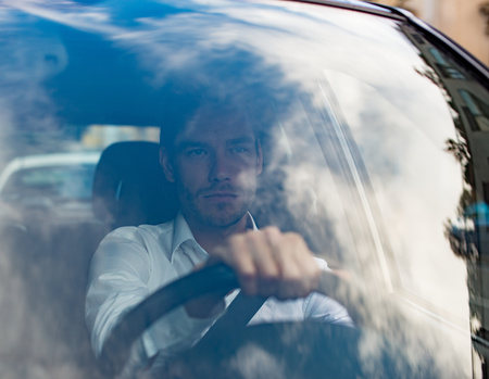 Portrait of a man driving his carの写真素材