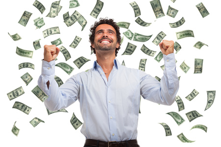 Happy man enjoying a rain of moneyの写真素材