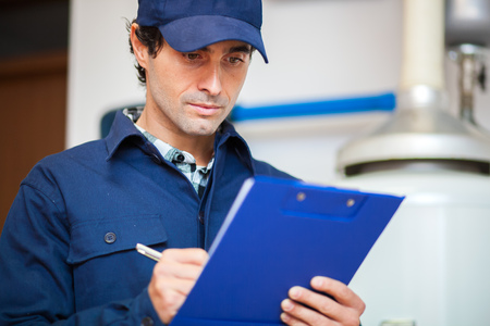 Technician servicing an hot-water heater