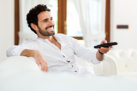 Man choosing the right TV program