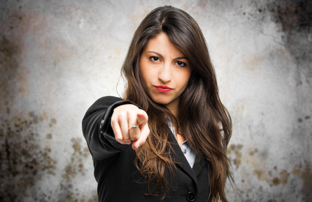 Businesswoman pointing at you