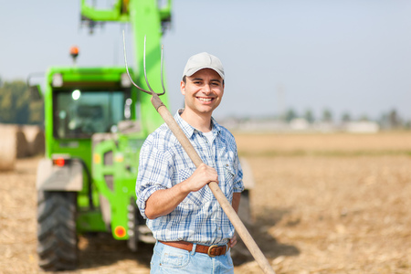 Farmer holding a pitchforkの写真素材