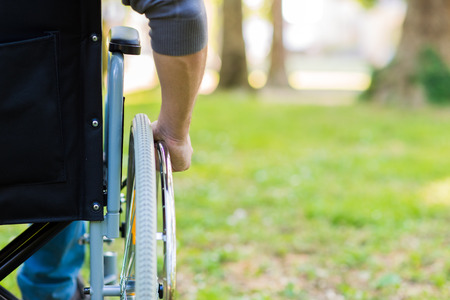 Detail of a man using a wheelchairの写真素材