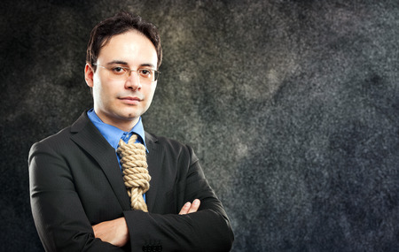 Businessman showing a loop knot instead of his necktieの写真素材