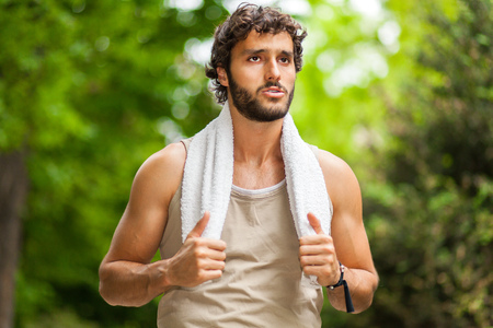 Portrait of a guy doing fitness outdoorsの写真素材