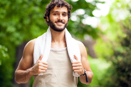 Portrait of a guy doing fitness outdoorsの写真素材