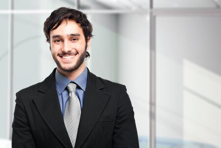 Smiling businessman in his officeの写真素材