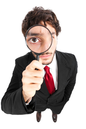 Man looking through a lensの写真素材