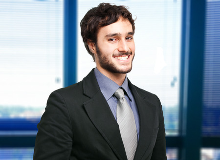 Smiling businessman in his officeの写真素材