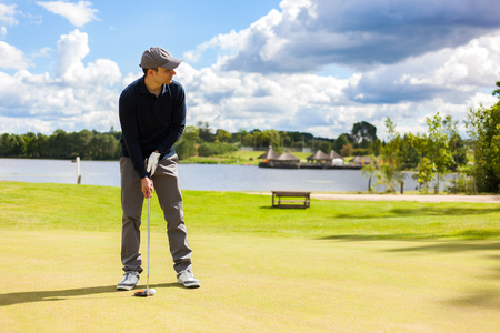 golfer shooting a golf bal