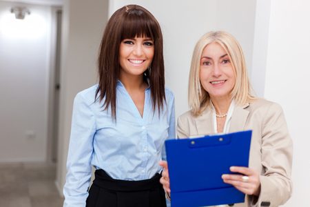 Smiling women working together in their officeの写真素材