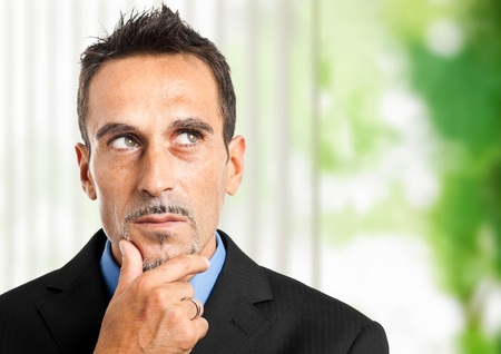 Thoughtful businessman portraitの写真素材