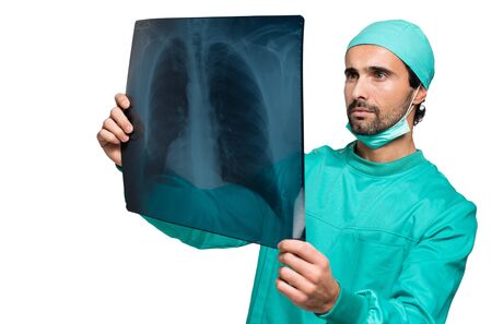 Surgeon analyzing a lung radiographyの写真素材
