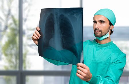 Portrait of a doctor looking at a radiographyの写真素材