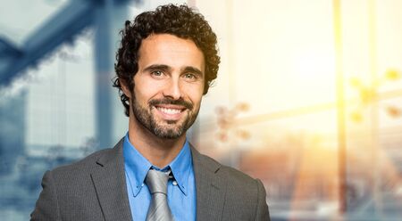 Portrait of a smiling confident businessmanの写真素材
