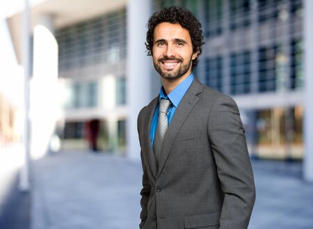Handsome businessman portrait outdoorの写真素材
