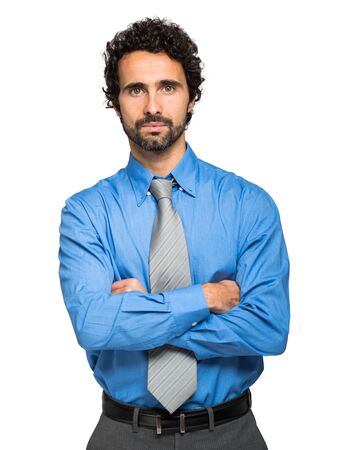 Portrait of a serious businessman, isolated on white backgroundの写真素材