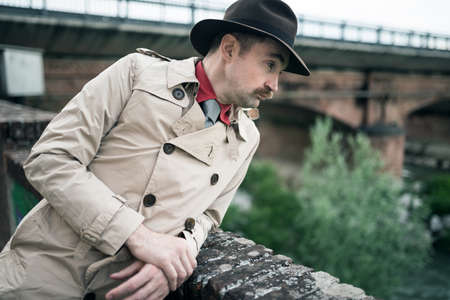 Detective spy man near a bridgeの写真素材