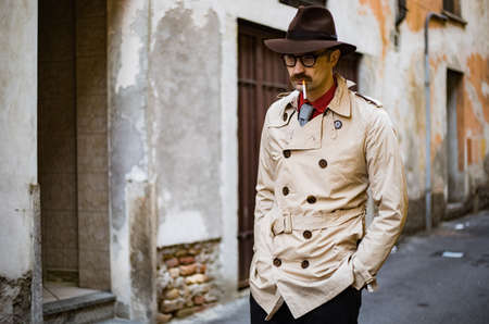 Detective walking in the city slumsの写真素材