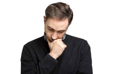 Mature man thinking against a white backgroundの写真素材