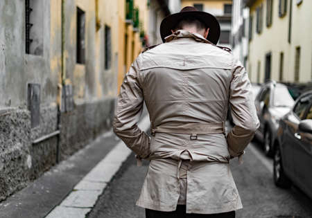 Detective walking in the city slumsの写真素材