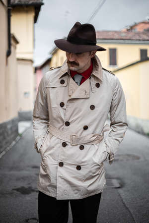 Detective walking in the city slums