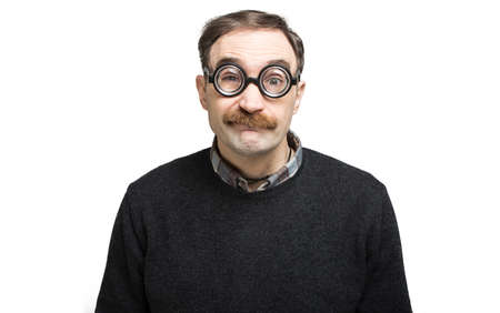 Funny portrait of a ner mand wearing nerd glassesの写真素材