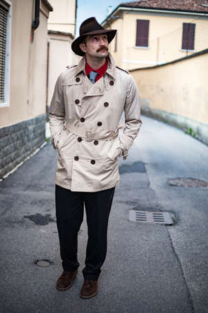 Detective walking in the city slumsの写真素材