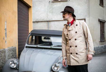 Detective walking in the city slumsの写真素材