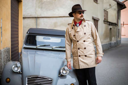 Detective walking in the city slumsの写真素材