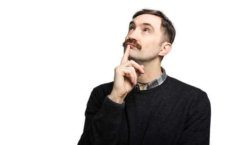 Mature man thinking against a white backgroundの写真素材
