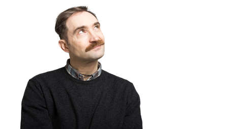 Mature man thinking against a white backgroundの写真素材
