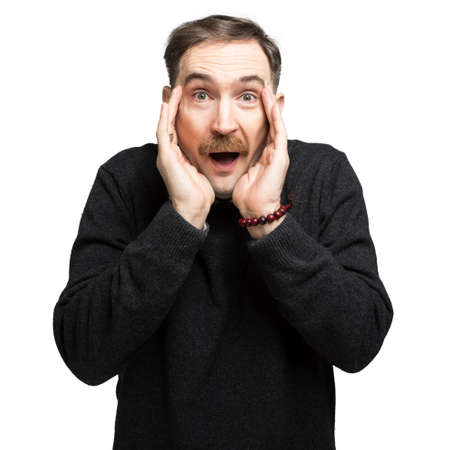 Portriat of a mature man in an amazed expressionの写真素材