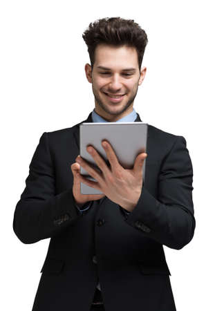 Businessman using his tablet computer. Isolated on whiteの写真素材
