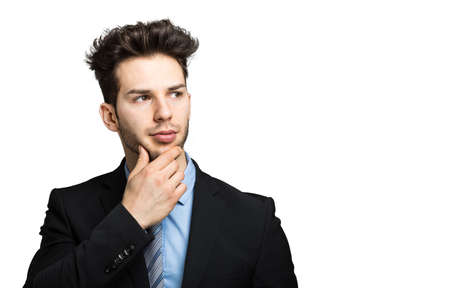 Thoughtful businessman isolated on whiteの写真素材