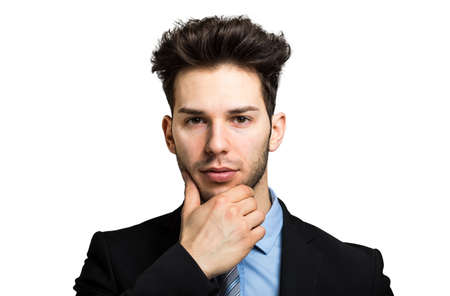 Thoughtful businessman isolated on whiteの写真素材