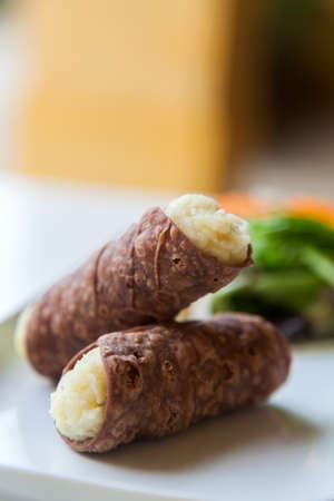 Two Tasty Cannoli on a Plate.の写真素材