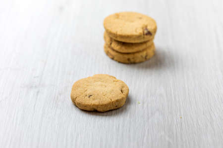 Chocolate homemade pastry cookies on a bright wooden tableの写真素材