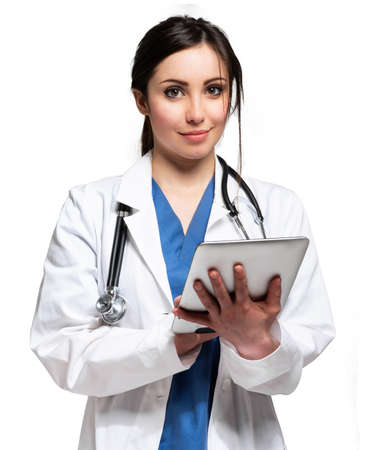 Smiling nurse portrait isolated on white using a digital tabletの写真素材