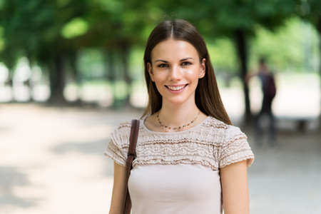 Smiling young beautiful woman portraitの写真素材